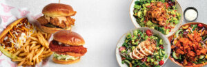 Flatlay image of fried chicken sandwiches and salads
